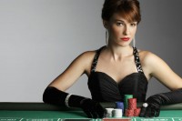 Attractive woman on casino table with chips