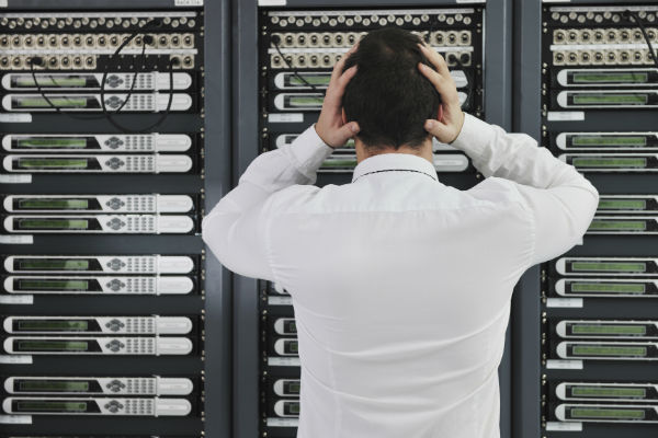 Man confused in front of servers