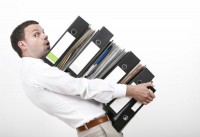 Man holding a stack of files