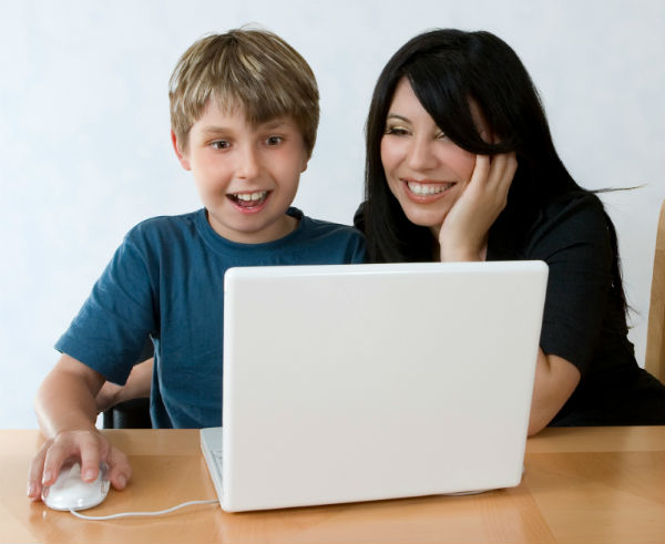 Mother and son looking at a laptop