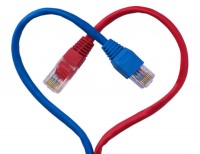 Blue and red UTP cables tied to a heart shape
