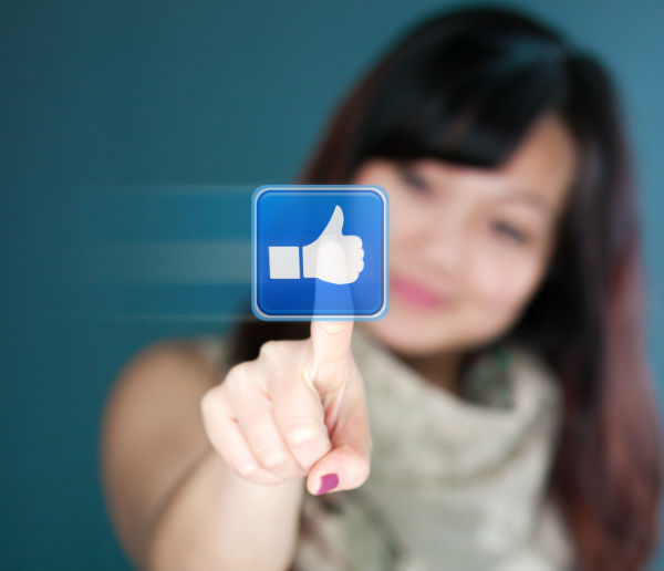 Asia woman pointing to a like button