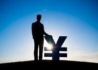 Silhouette of a man in a suit beside a Yen sign