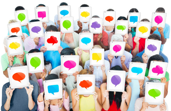 Group of people holding colorful thought bubbles over their faces