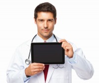 Male doctor holding up a tablet
