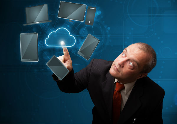 Man in suit touching virtual cloud