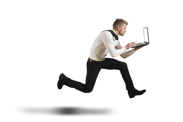 Running businessman holding a laptop