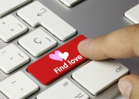 Finger pointing to a find love key on a keyboard