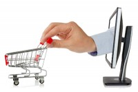 Hand out of PC with shopping cart